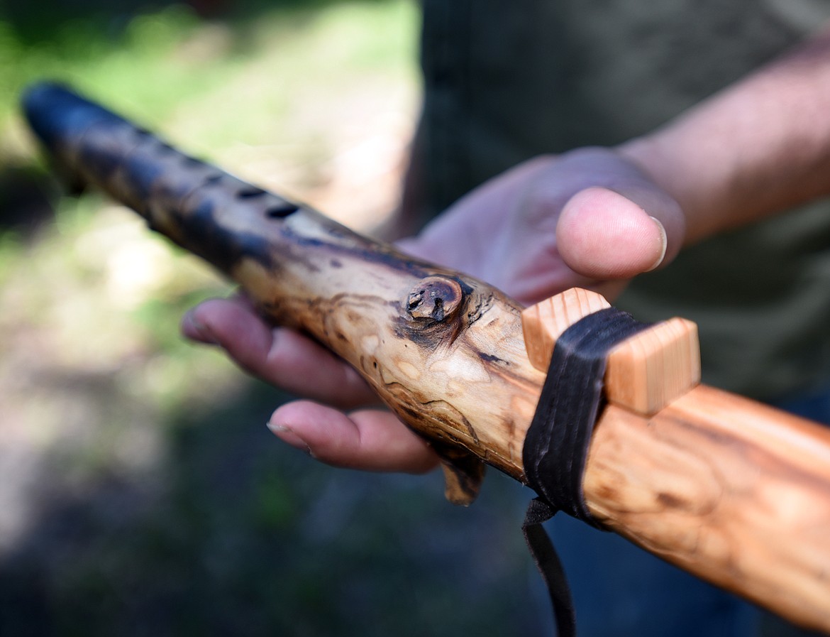 Niko Keys of Cedar Cabin Music shows of the one flute that he says he will never sell for any price.(Brenda Ahearn/Daily Inter Lake)