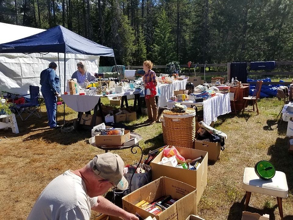 The Happy Homemakers with the De Borgia Schoolhouse Foundation, hosted a Cowboy Breakfast and yard sale on Friday and Saturday in conjunction with the St. Regis town wide sale. Friday sunny skies turned dark and cloudy by Saturday but didn&#146;t discourage shoppers. (Photo courtesy of Happy Homemakers)