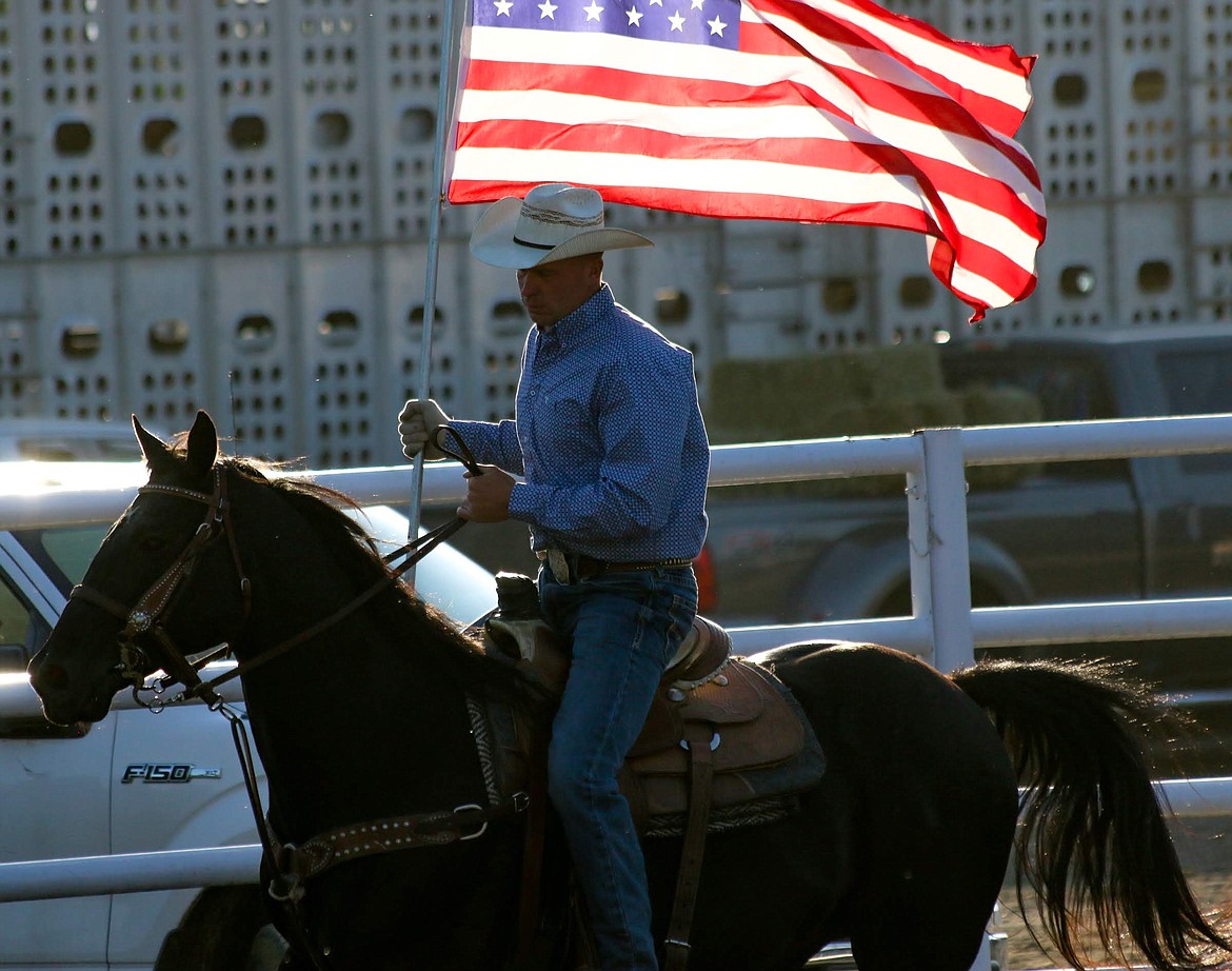 Photo by MANDI BATEMAN
Bull Bash 2018. Andy Rice and his steed galliantly carried the American Flag around the arena.