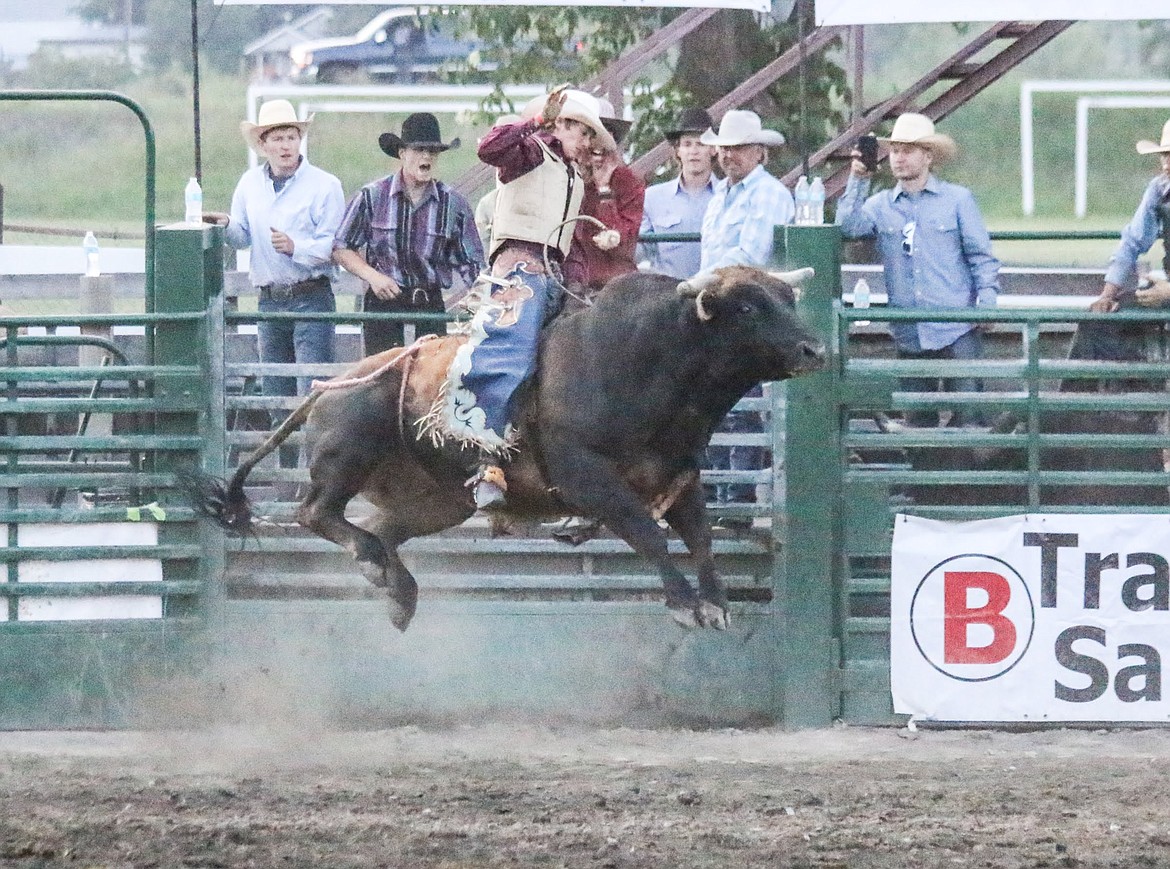 Photo by MANDI BATEMAN
Bull Bash 2018. Payton Fitzpatrick soars high on his bull nemesis, as the duo battle for the win.