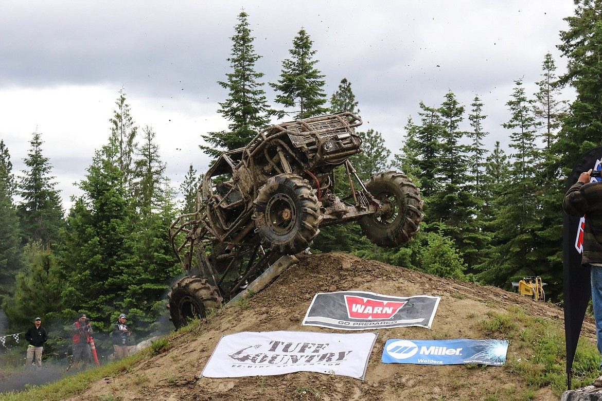 Photo by MANDI BATEMAN
Neil Harris crosses the finish line during the Warn Rock Course.