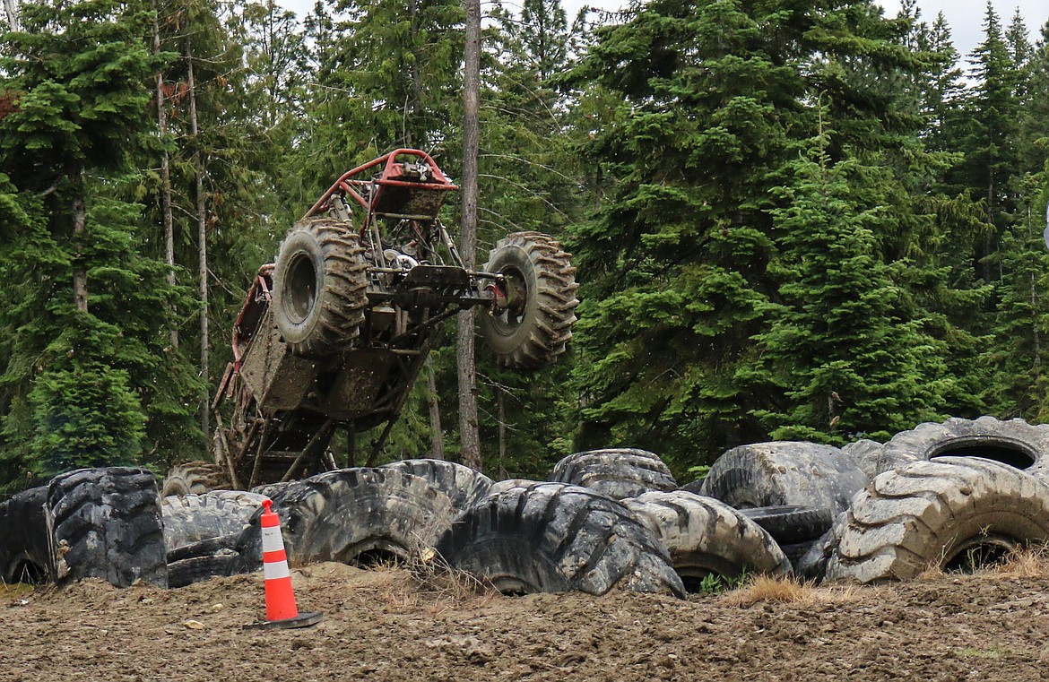 Photo by MANDI BATEMAN
Kelly Day blasts onto the tire obstacle....