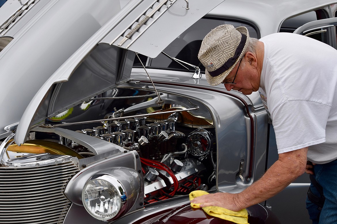 Charles H. Featherstone/Columbia Basin Herald
Yakima resident Bill Trefry polishes his heavily customized 1938 Chevrolet Master Deluxe. &#147;I&#146;ve had this ten years, and it&#146;s never been in a professional shop,&#148; he said. &#147;It&#146;s all original except for the running boards.&#148;