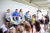 Big Bend athletes give out books