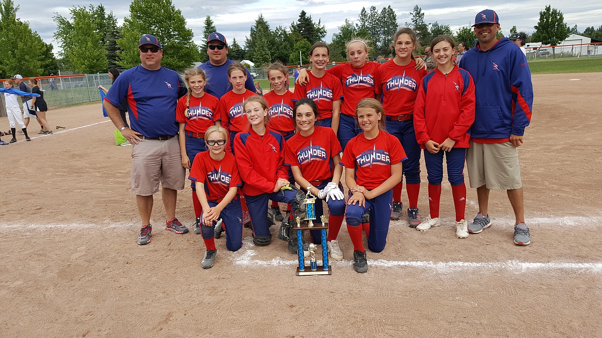 Courtesy photo
The Lake City Thunder placed second in the Crush/In Motion fastpitch softball  tournament in Post Falls over Father&#146;s Day weekend. In pool play, the Thunder defeated the Post Falls Blast 12-0 on the strength of Makiya McPhedran&#146;s 9-strikeout no hitter. McPhedran also went 2 for 3 and Natalya Lucero went 2 for 2 in the win.  Game 2 was a 12-5 loss to the Spokane Stealth. Lucero went 2 for 2 with a triple and Tapanga Rojas hit a home run. The Thunder defeated the Colville Tribe 14-3 with Lucero earning the win. Lucero and McPhedran both went 2 for 3 with a triple. In championship play, Rojas hit a 3-run home run to back pitcher Brooklyn Wullenwaber as the Thunder defeated the Washington Rampage 12-4.  Wullenwaber went 2 for 3. The Thunder defeated the North Idaho Bombers in the semifinal. McPhedran had 11 strikeouts, and Layla Gugino went 2 for 3 with a triple and an RBI. Rojas knocked in Gugino to score the winning run.   The championship game went to extra innings where the Spokane Stealth defeated the Thunder 13-11. Kylin Chavez had 4 hits, McPhedran had 3 hits, and Wullenwaber had 2 hits to lead the Thunder. Cassie Zaring and Gugino had 2 RBI each. 
In the front row from left are Brooklyn Mendonca, Cassie Zaring, Natalya Lucero and Layla Gugino; and back row from left, head coach Levi Wullenwaber, Alycia Cameron, coach Morgan Gugino, Natalie Singer, Chloe Burke, Brooklyn Wullenwaber, Makiya McPhedran, Tapanga Rojas,  Kylin Chavez and coach Jason Chavez.