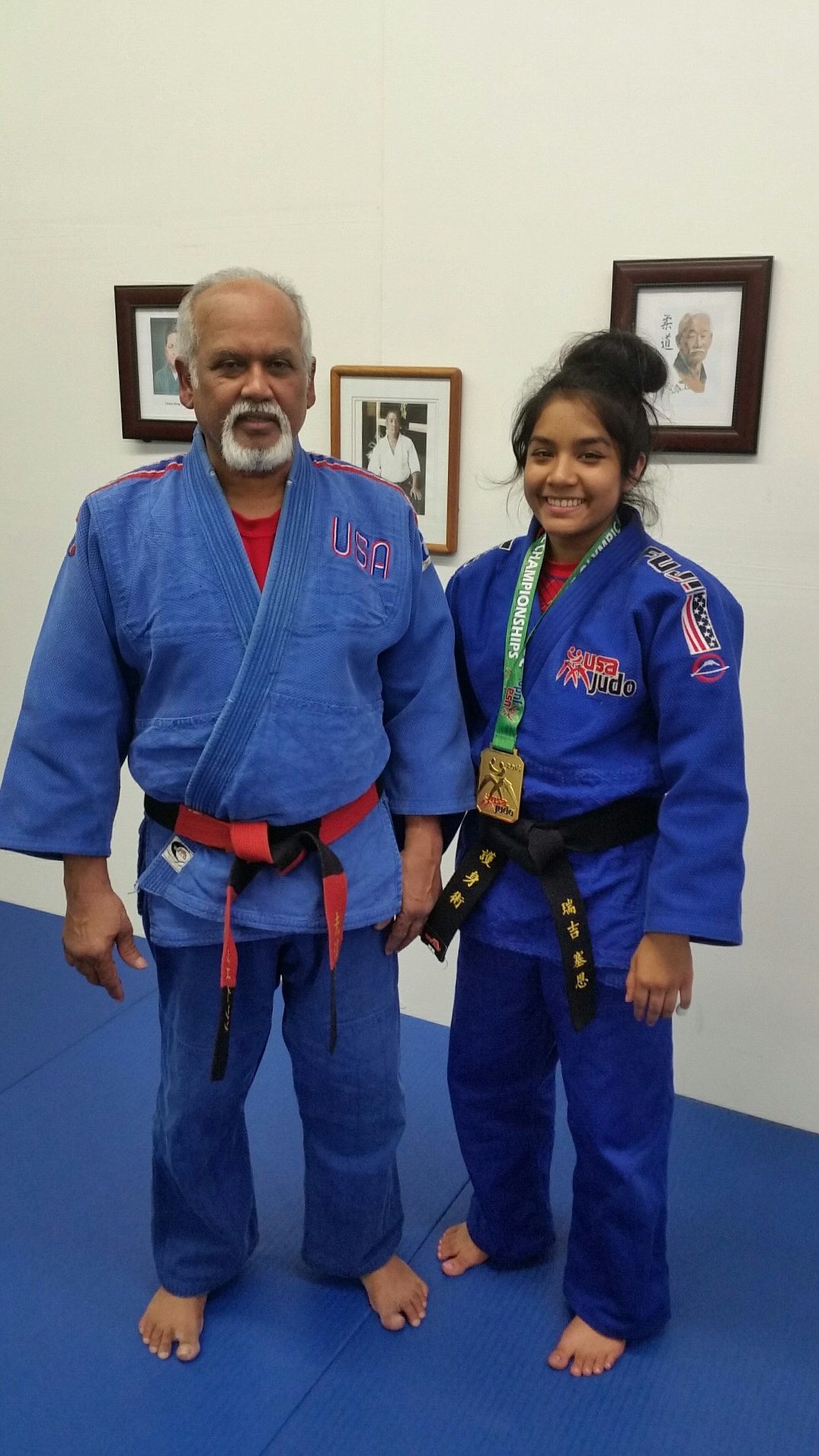 Courtesy photo
Raji Singh, right, representing the Goshinjitsu School in Post Falls at the Forge Fitness Center won the gold at the 2018 Junior Olympic championshisp in Spokane. At left is instructor Bijay Singh.