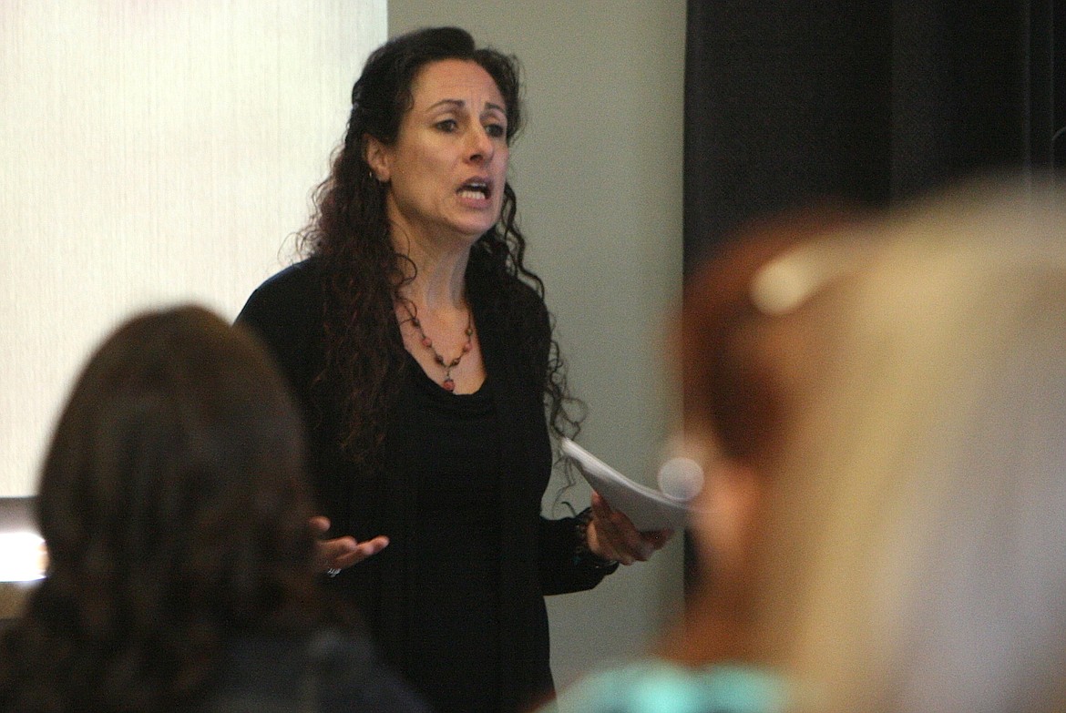 Shannon Corder, a clinical social worker with Kootenai Behavioral Health, speaks to attendees of the Financial and Mental Wellness in the Workforce workshop on Thursday at the Idaho Department of Labor in Post Falls. (BRIAN WALKER/Press)