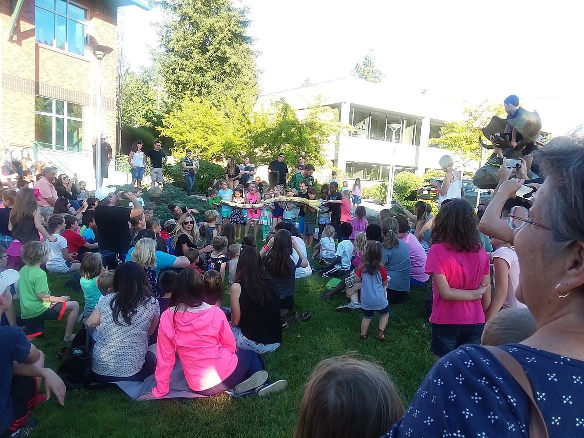 Courtesy photo
Kids enjoy a visit June 20 at Coeur d&#146;Alene Public Library from the &#147;reptile man,&#148; zoologist Scott Peterson, who brought live animals for them to look at and touch.