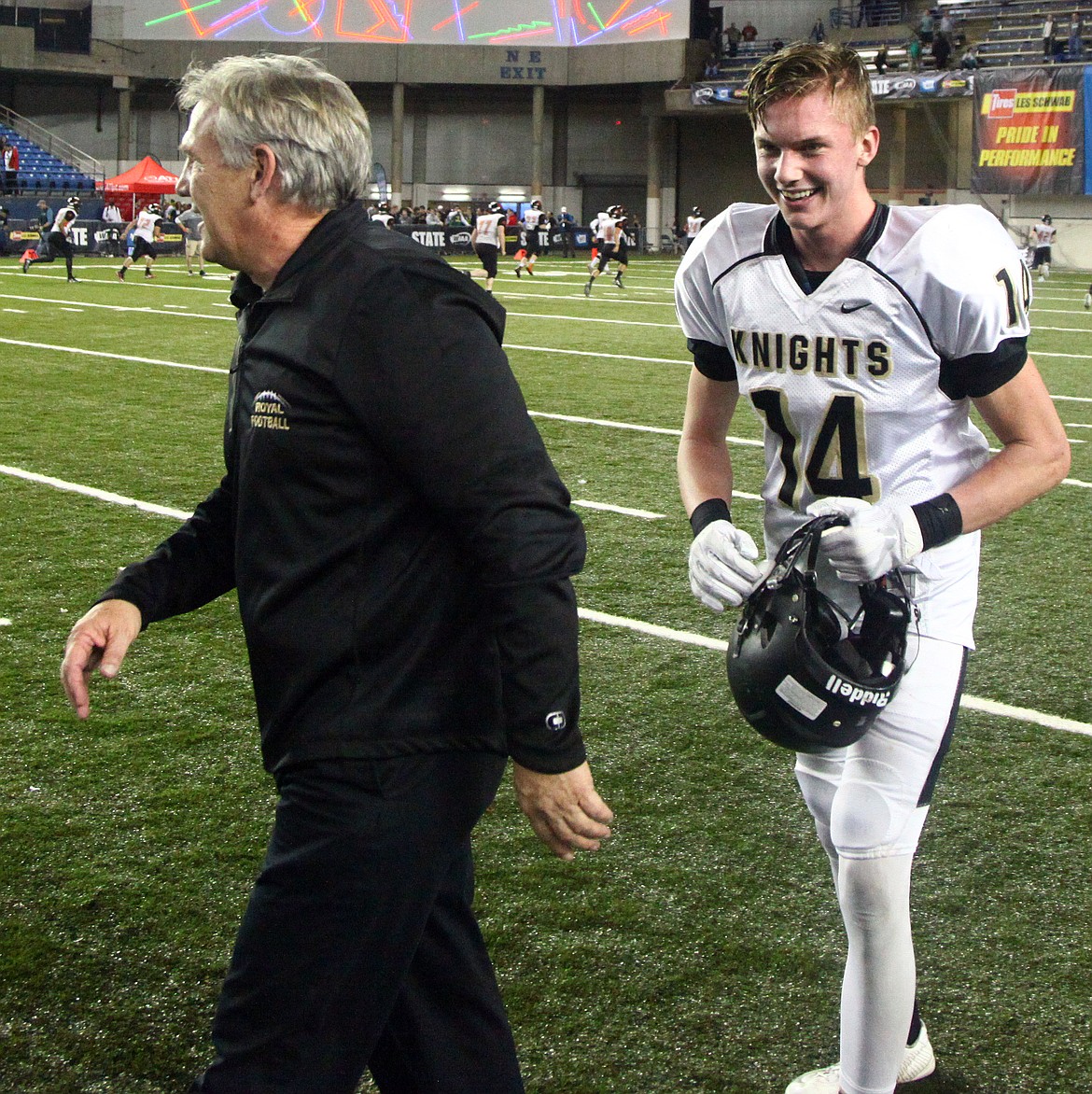 Columbia Basin Herald fileCorbin Christensen (14) walks off the field with Royal head coach Wiley Allred after the Knights won their third consecutive 1A state football championship.