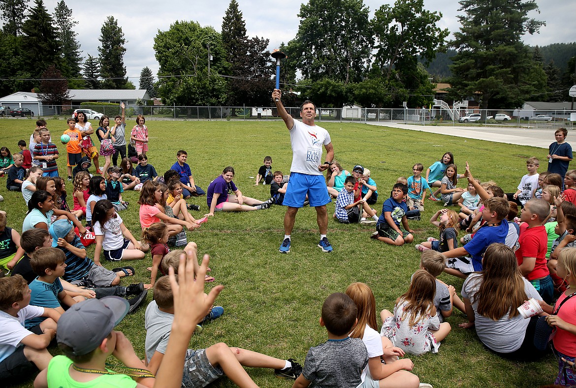 Arpan De Angelo&#146;s of the Sri Chinmoy Oneness-Home Peace Run has kids at the Boys and Girls Club guess his pose Friday afternoon in Coeur d&#146;Alene. The running group consists of participants from seven countries, and is spending four months to complete its 11,000-mile relay around the United States to promote peace, harmony and friendship among school children and those in youth organizations. (LOREN BENOIT/Press)