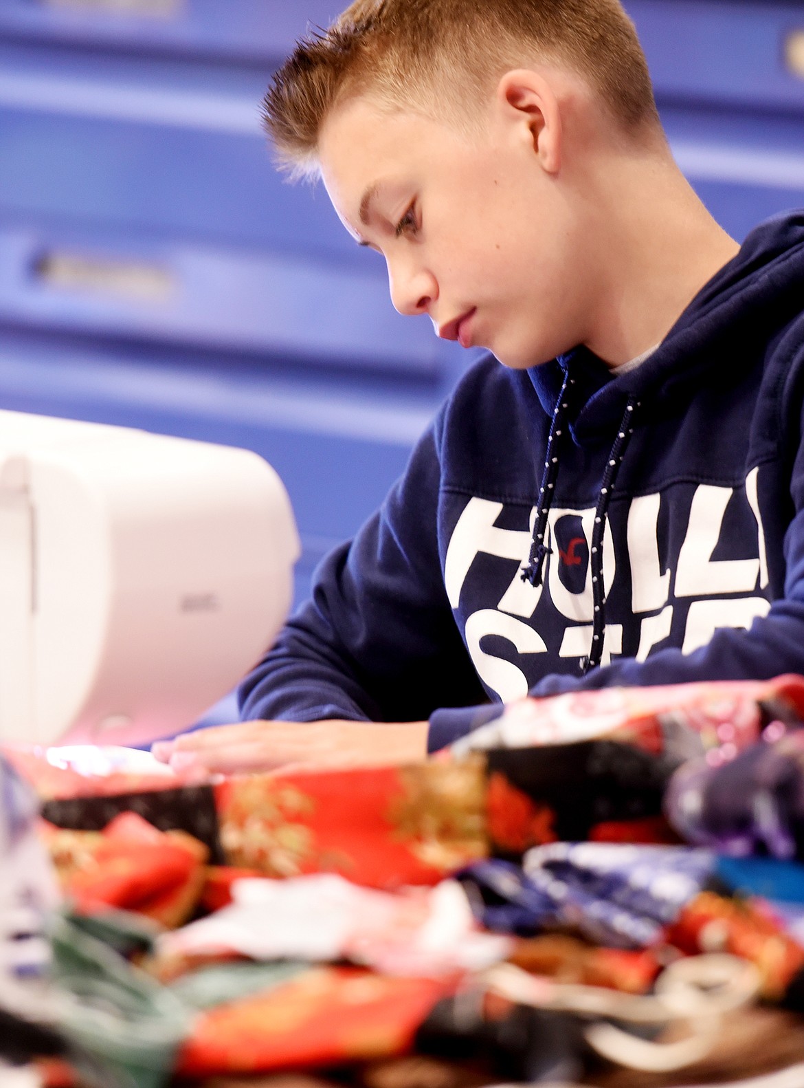 Isaiah Goodson takes part in the quilting camp.