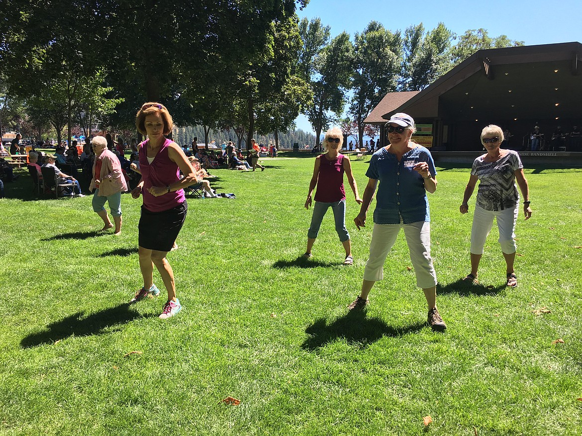 Concert attendees shake it up during a Handshake Productions concert in Coeur d&#146;Alene City Park. Handshake is bringing free concerts to the community for the 27th year. Shows will be Sundays in City Park, Tuesdays in Sherman Square Park and Thursdays in Hayden. (Courtesy photo)