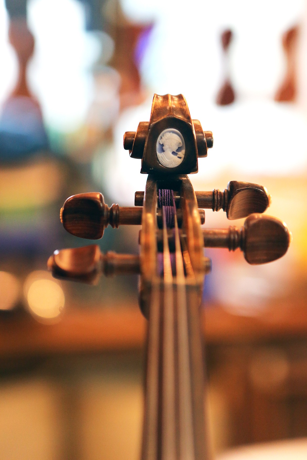 A cameo is inlayed in the base of a scroll in one of Tom Simensen&#146;s custom violins. (Mackenzie Reiss/Daily Inter Lake)