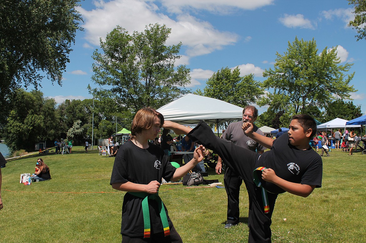 Joel Martin/Columbia Basin Herald
Students from Freewind Martial Arts show some impressive kicks at the Duck Derby fundraiser Saturday.