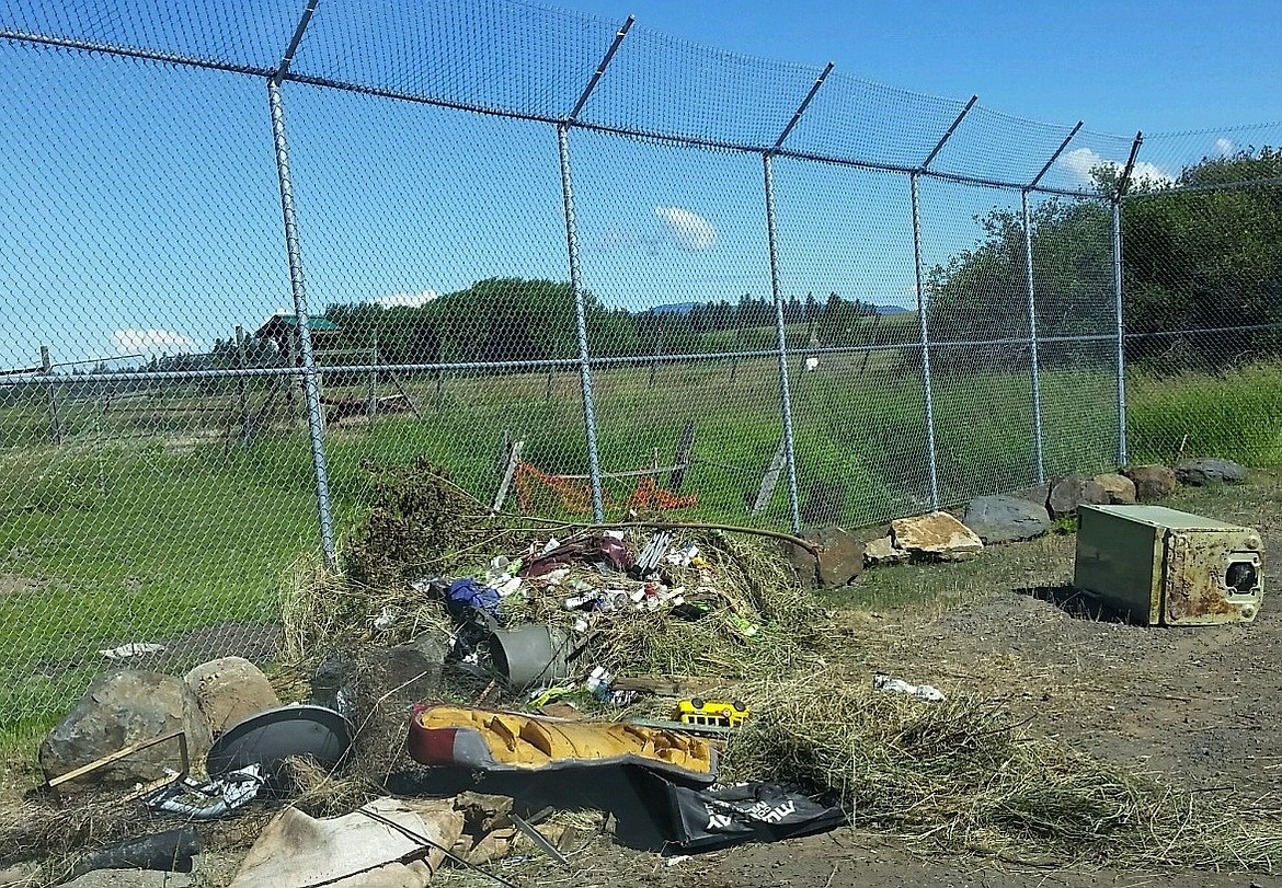 This rural collection site near Worley shows how waste is disposed outside containters, which requires a special cleanup by Kootenai County staff. (Courtesy photo)