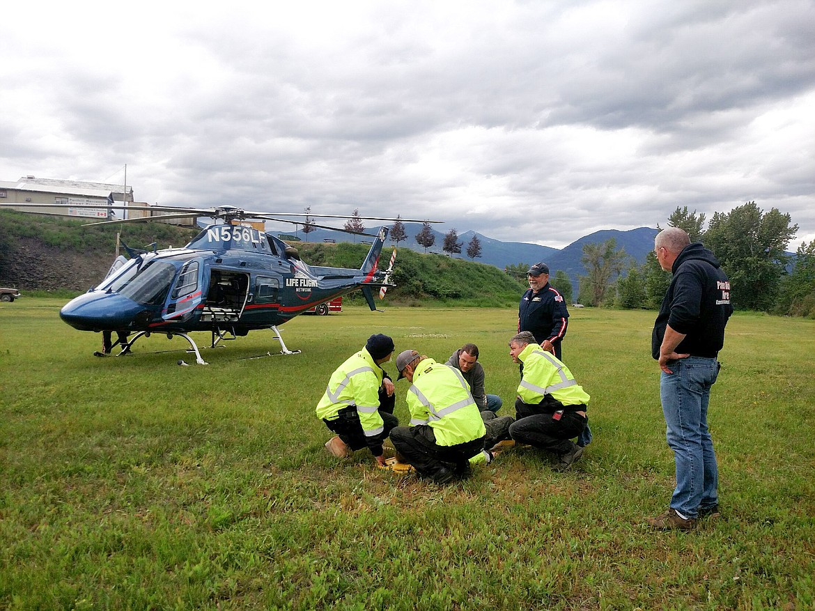 Photo by SANDY STEINHAGEN
The firefighters learned important lessons about loading a patient in the helicopter.