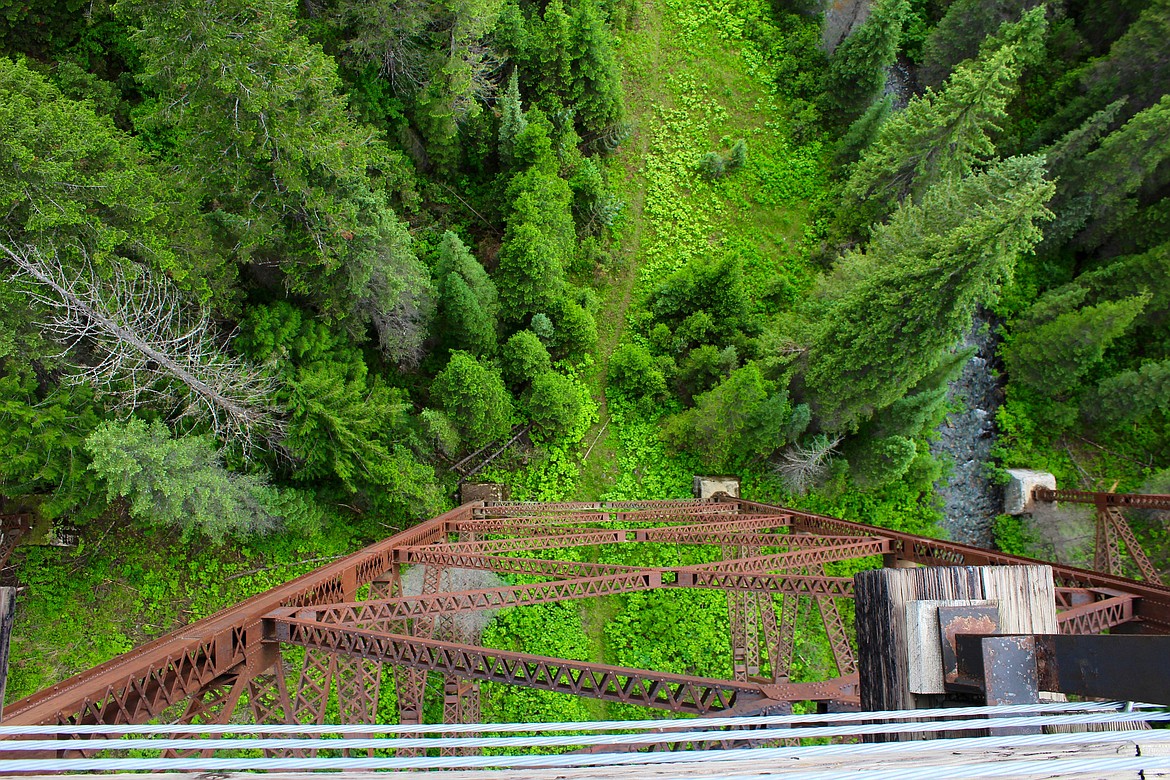 Photo by CHANSE WATSON
A straight down view from one of the seven trestles on the Route of the Hiawatha. These structures, constructed of steel and concrete, were designed to provide a smooth ride while eliminating impact stress and vibration resulting from trains. Work to address deteriorating concrete and other needed maintenance on the trestles is estimated at more than $1 million.