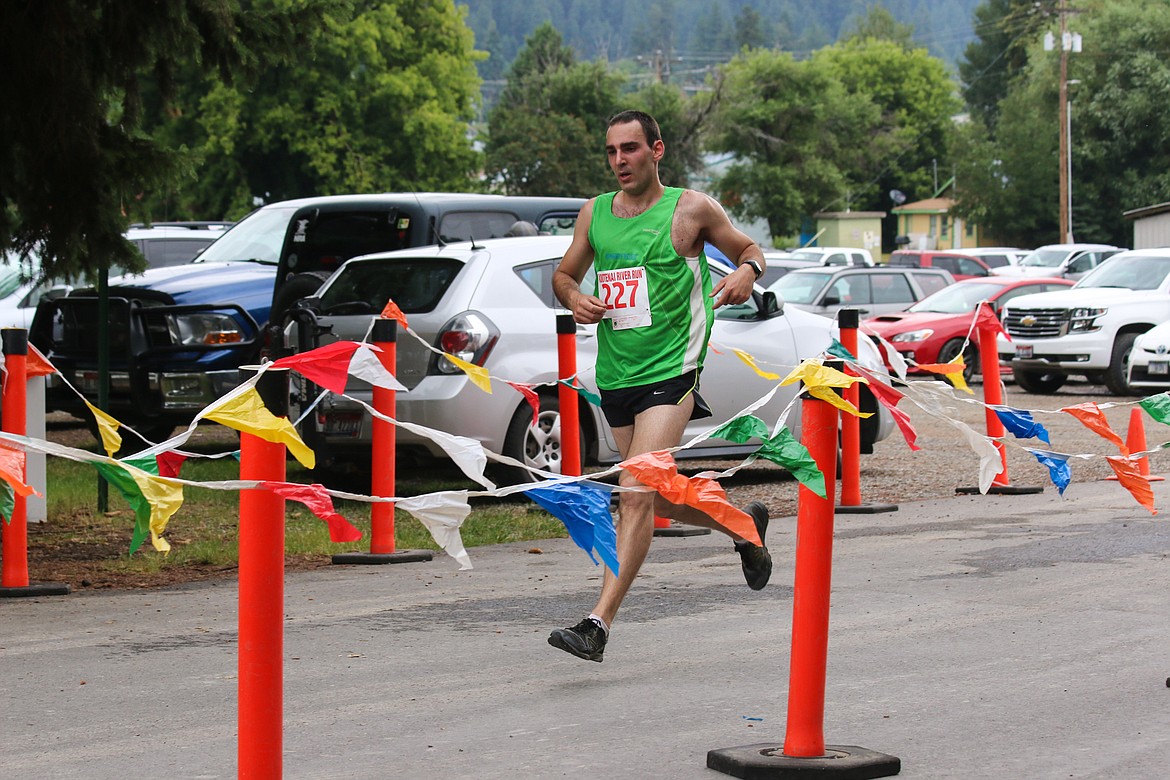 Photo by MANDI BATEMAN
Micah Krmpotich at the finish line. He won the Men&#146;s 10K with a time of 39:01, also making him the overall winner of the 10K Race.