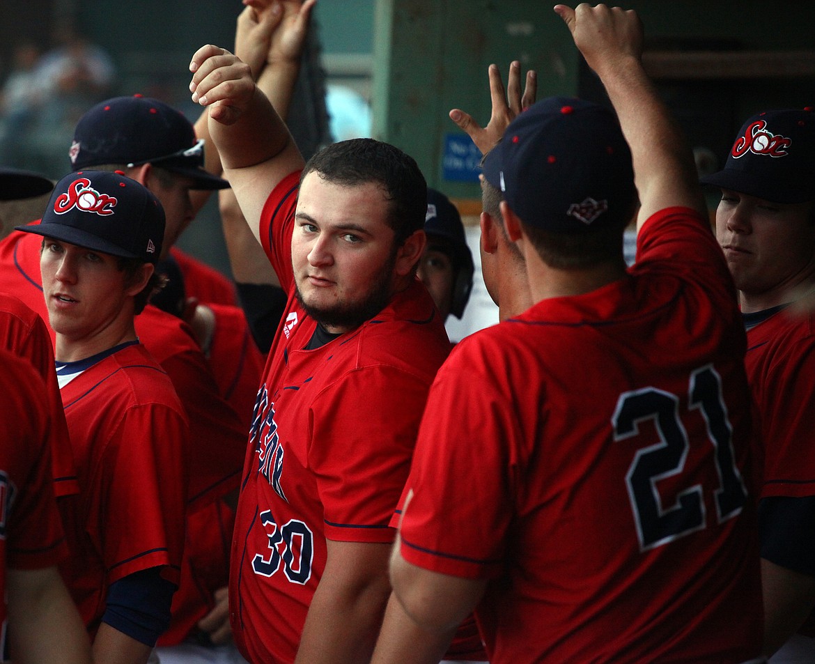 Rodney Harwood/Columbia Basin HeraldHunter Boyd (30) of Moses Lake joins in the celebration after the Wenatchee AppleSox scored a run against Kelowna in West Coast League action.