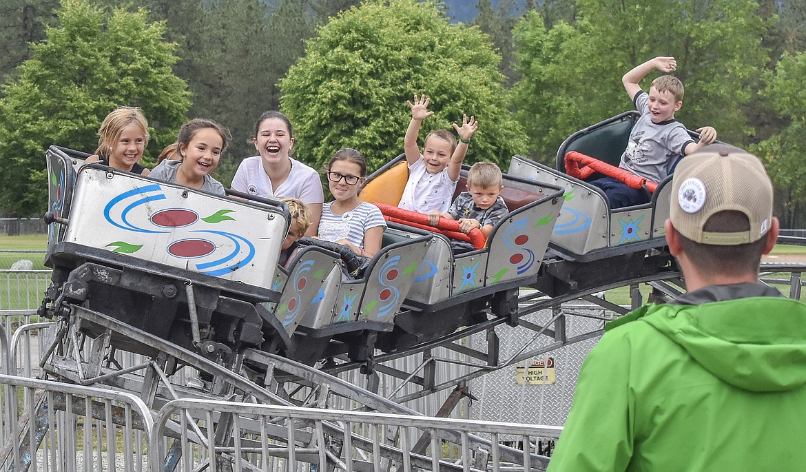 Children of all ages enjoy the roller coaster at Libby Logger Days on Saturday. (Ben Kibbey/The Western News)