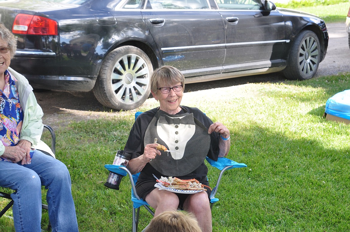 PEGGY ROSS of Ronan shows off her tuxedo bib, made by her daughter Debbie, at the Ronan Crab Fest last Friday at Bockman Park. (Ashley Fox/Lake County Leader)