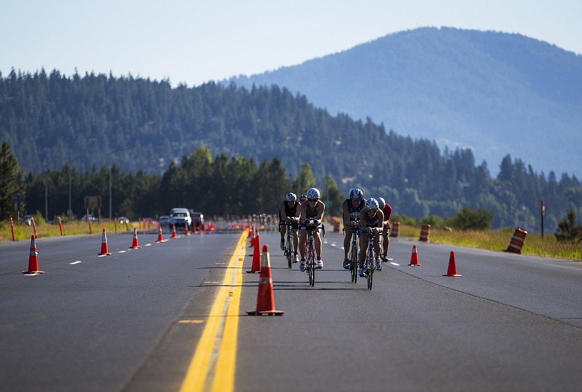 A group of Ironman athletes bike flat ground before making the climb up Mica Grade during Ironman 70.3 Coeur d'Alene IN 2017. (LOREN BENOIT/Press File)