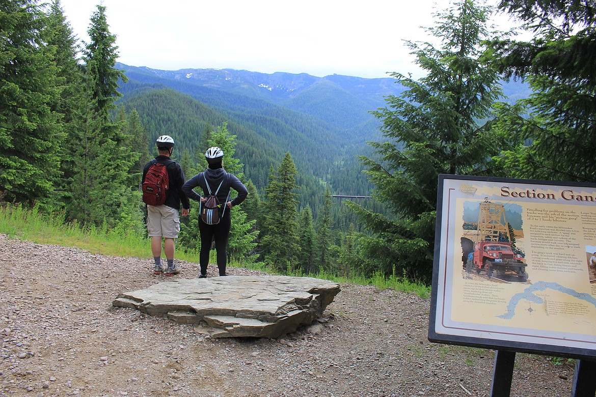 NICK AND Mariah Turnbull look out over one of seven trestles that wind down through the St. Joe Ranger District of the Idaho Panhandle National Forests and straddles the Idaho/Montana Stateline in the Bitterroot Mountains as part of the Route of the Hiawatha bike trail.