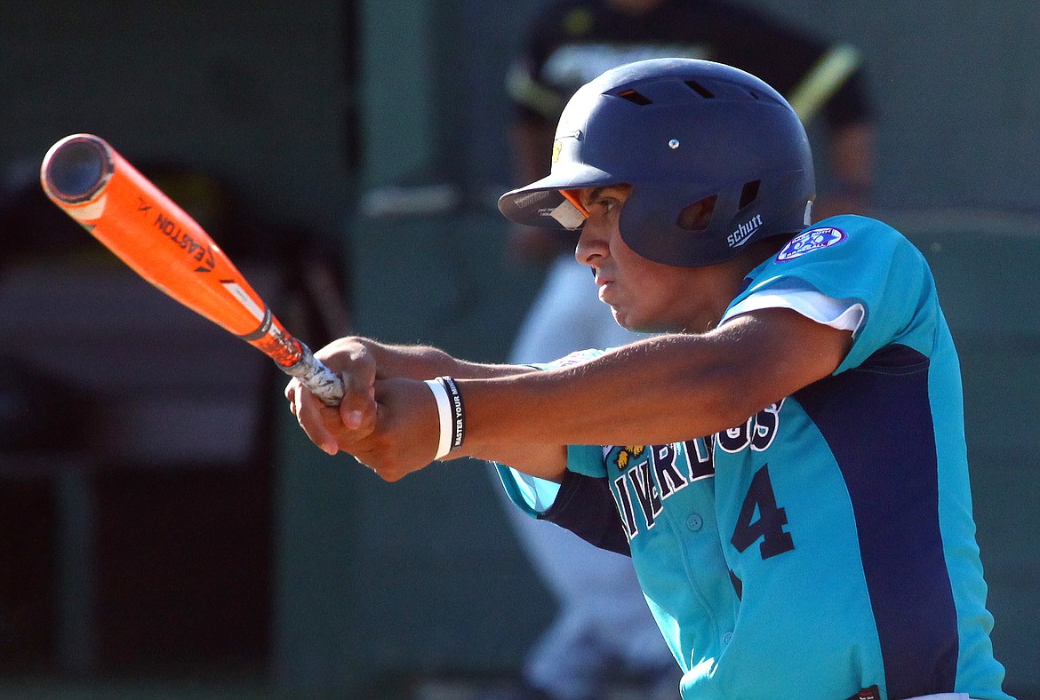 Rodney Harwood/Columbia Basin Herald
River Dogs second baseman Camron Valdez of Othello takes a swing during his at-bat against the Spokane Crew during Senior Babe Ruth League action at Johnson-O'Brien Stadium.