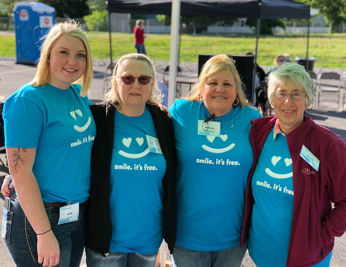 (L-R) Lexi, Pat, Melody and Ellen get patients regstered for the day before they headed inside to see one of the five dental practioners on hand (Erin Jusseuame/ Clark Fork Valley Press)