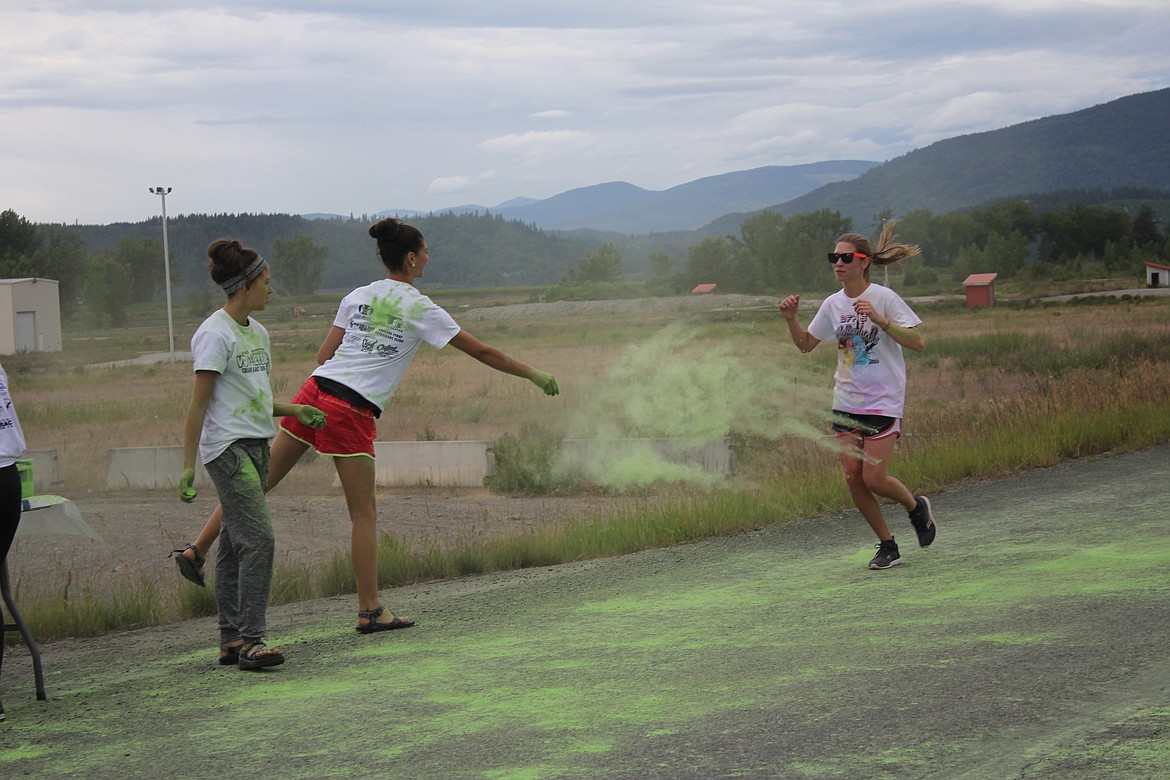 Photo by TANNA YEOUMANS
The attendees throwing the chalk may have gotten more on themselves than the runners.