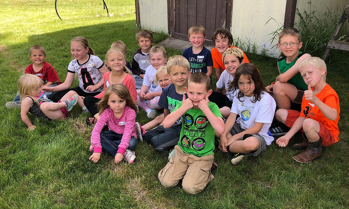 There were plenty of big smiles from the kids as they posed for a group photo during one of their outdide activities (Erin Jusseaume/ Clark Fork Valley Press)