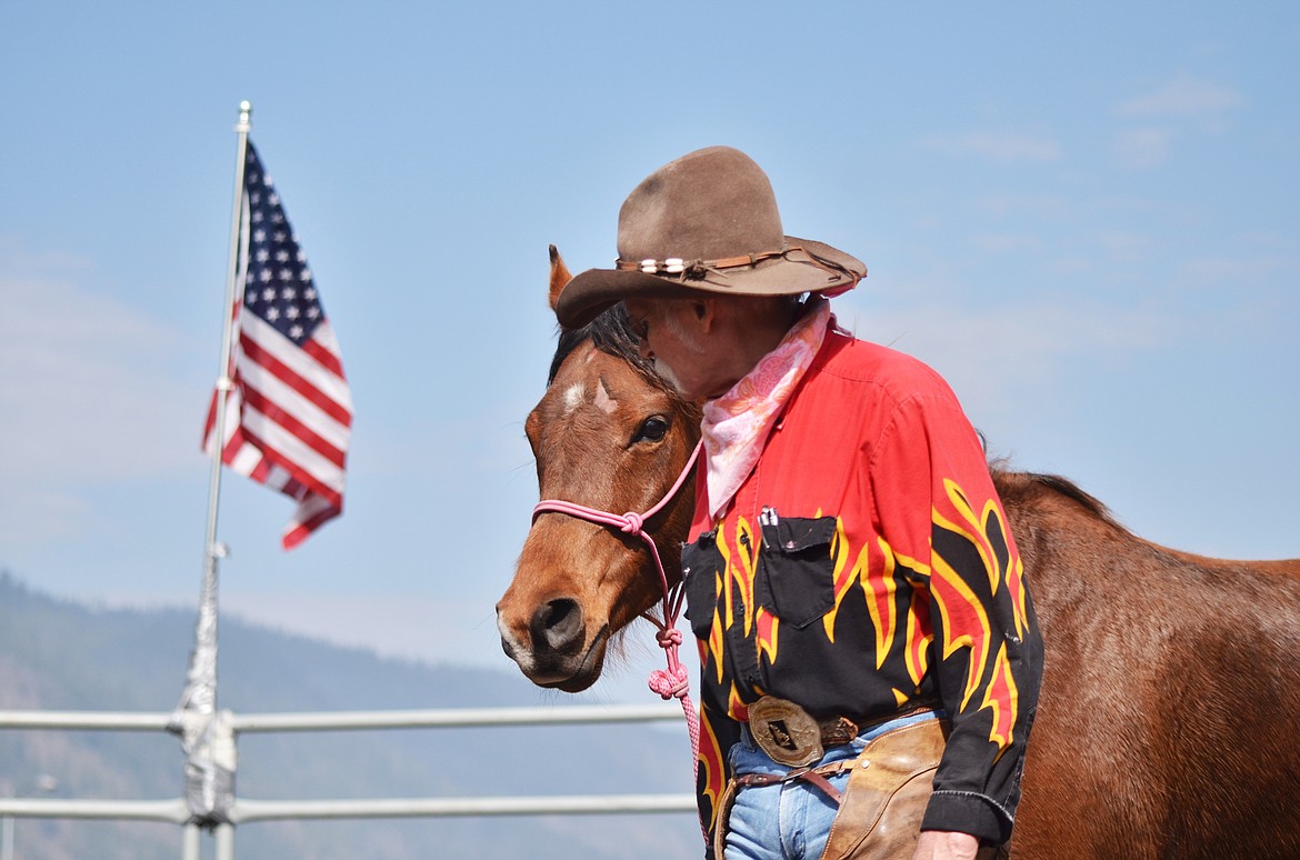 Under the Montana big sky and the American flag, magical moments will happen between the cowboy and his horse (Erin Jusseaume/ Clark Fork Valley Press)