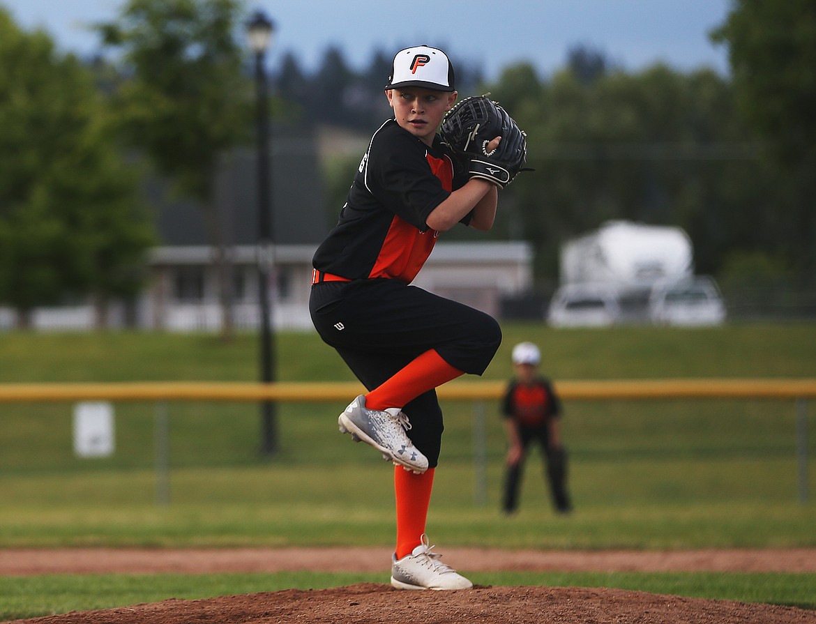 Cole Long of Post Falls delivers a pitch against Sandpoint in a Little League District 1 tournament Majors game at Canfield Sports Complex.
 
LOREN BENOIT/Press