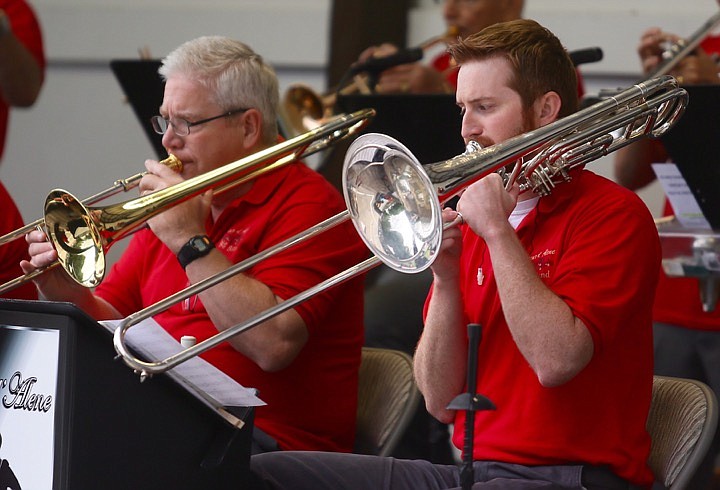 Photos by JUDD WILSON/Press
Andrew Asper, right, and Deny Burt, left, wield their mighty trombones to entertain hundreds at the Coeur d&#146;Alene Big Band&#146;s concert Thursday at McIntire Family Park in Hayden.