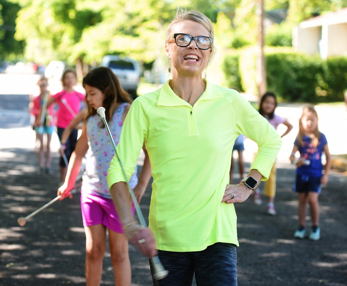 Jessica Louk leads members of the Treasure State Twirlers in practice outside Hedges Elementary.