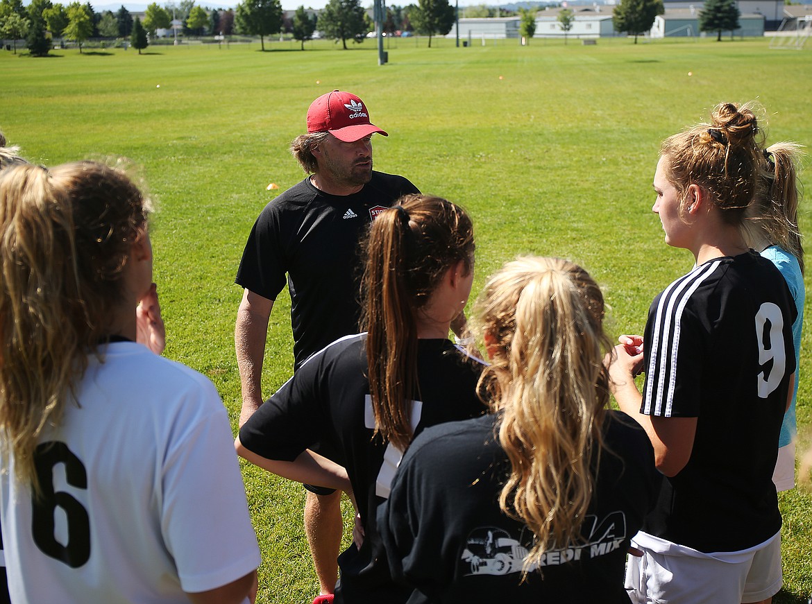 Sting Timbers FC 00/01 girls soccer coach Julio Morales debriefs his team at the end of practice Friday morning at the Coeur d&#146;Alene Soccer Complex. The Sting Timbers open the National Presidents Cup in Westfield, Ind., against CUFC of Charlotte on Thursday, then face Vereingung Erzgebirge of Warmister, Pa., and conclude the four-team pool play round against Green White FC of Mount Prospect, Ill. (LOREN BENOIT/Press)