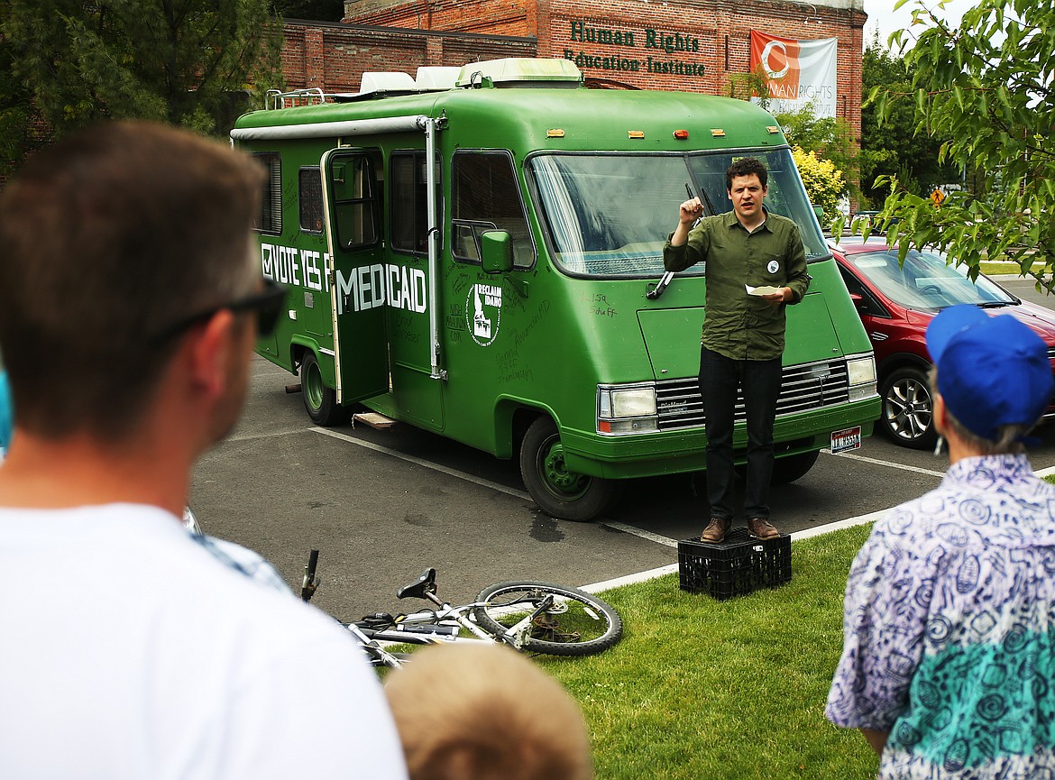 LOREN BENOIT/Press
Luke Mayville, who helped initiate Reclaim Idaho, spoke to about 30 people who turned out to meet the Reclaim Idaho &#147;Medicaid Express&#148; when it made a stop to the Human Rights Education Institute Thursday in downtown Coeur d&#146;Alene.