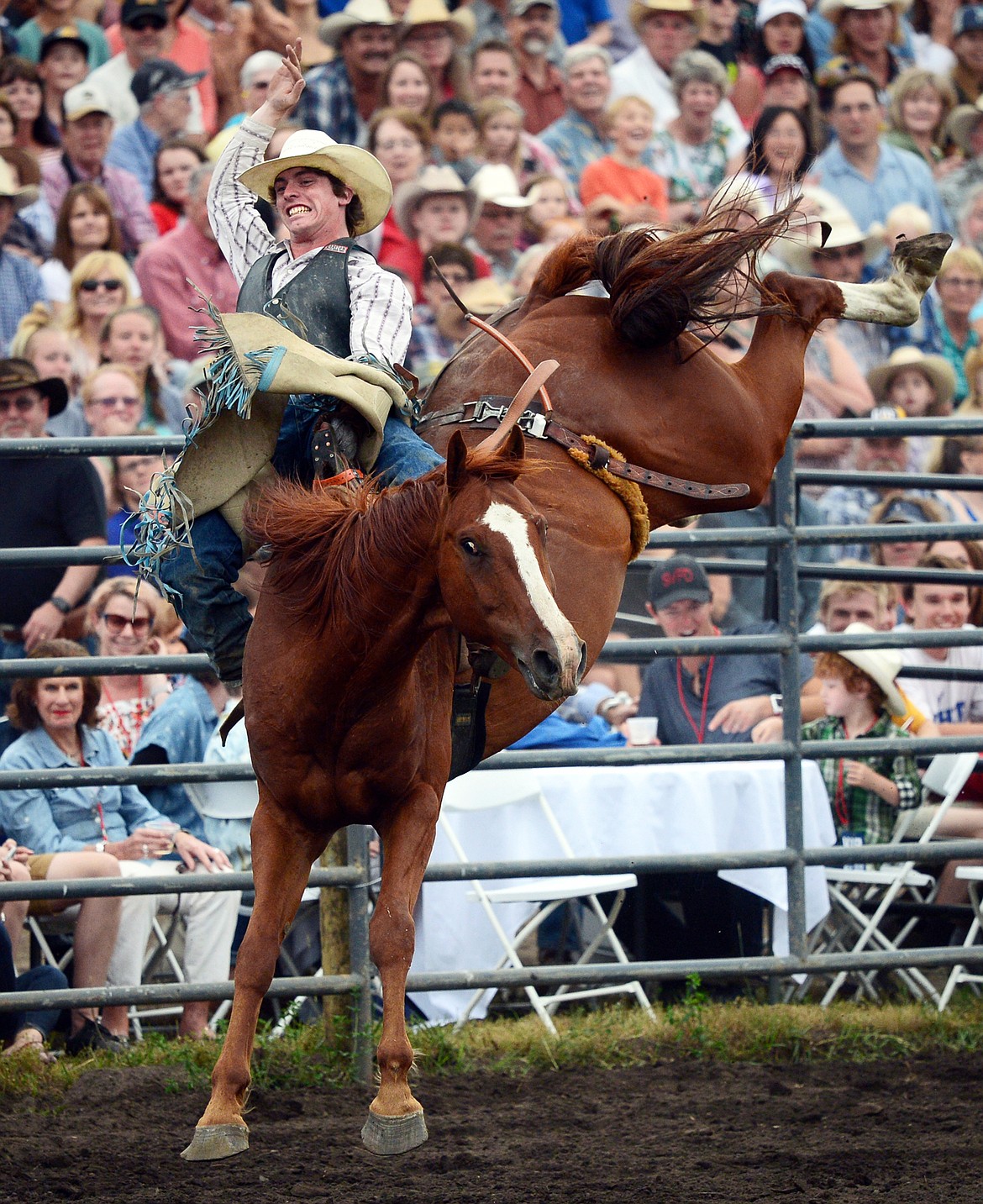 Troy Kirkpatrick, of Wise River, hangs on to his horse Sage Brush during the Bareback Riding event at the Bigfork Summer Pro Rodeo on Friday. (Casey Kreider/Daily Inter Lake)