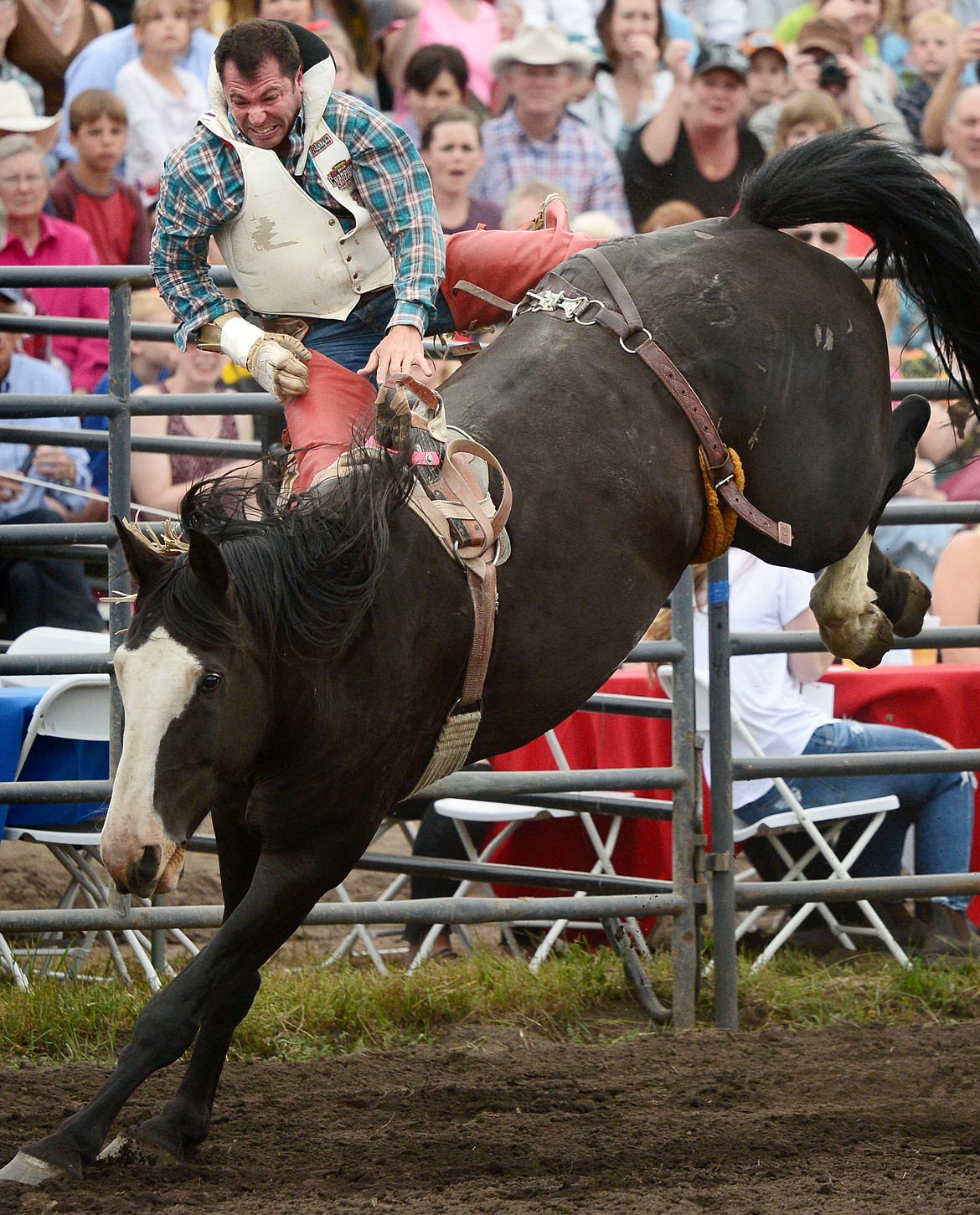 George R. Gillespie IV, of Darby, is thrown from his horse 3 Seconds Out during the Bareback Riding event at the Bigfork Summer Pro Rodeo on Friday. (Casey Kreider/Daily Inter Lake)