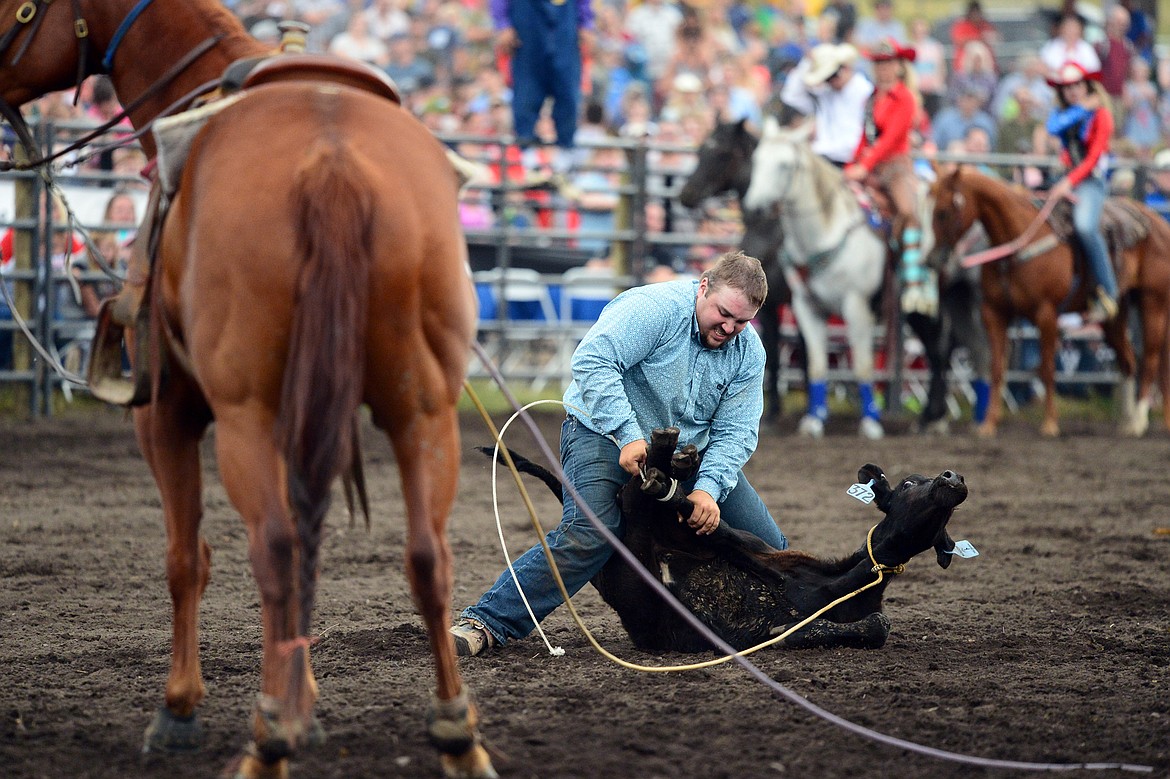 Logan Brown, of Miles City, competes during the Tie Down Roping event at the Bigfork Summer Pro Rodeo on Friday. (Casey Kreider/Daily Inter Lake)