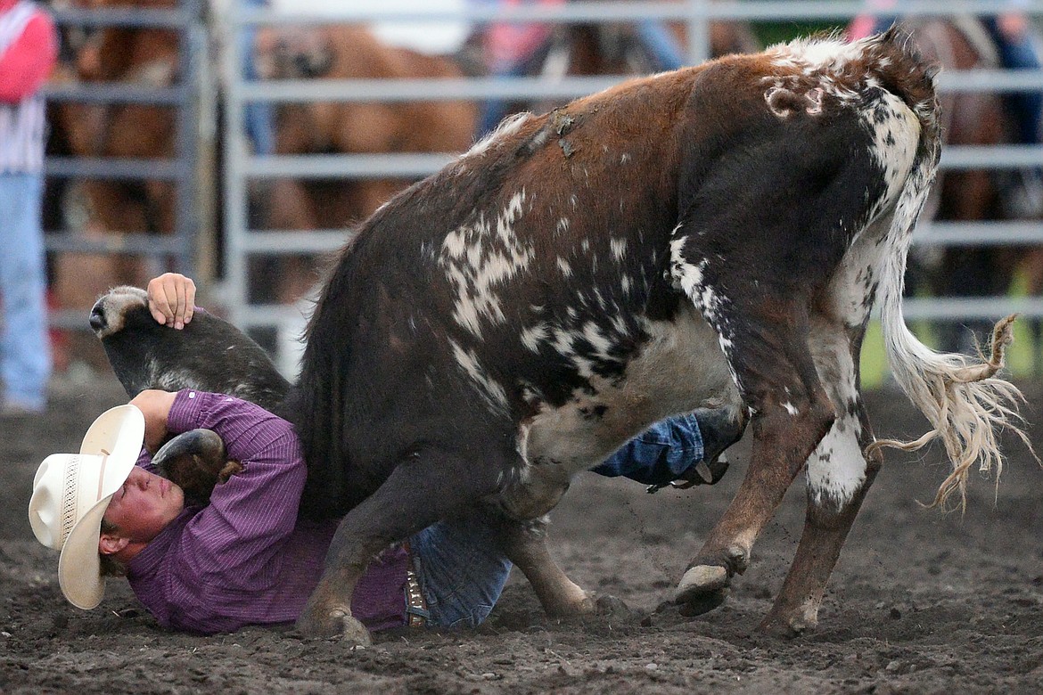 Kris Anderson, of Hamilton, competes during the Steer Wrestling event at the Bigfork Summer Pro Rodeo on Friday. (Casey Kreider/Daily Inter Lake)