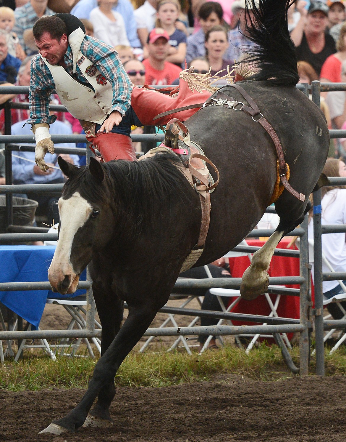 George R. Gillespie IV, of Darby, is thrown from his horse 3 Seconds Out during the Bareback Riding event at the Bigfork Summer Pro Rodeo on Friday. (Casey Kreider/Daily Inter Lake)