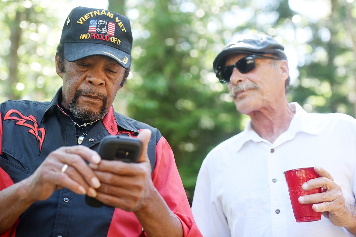 Charles Draine and Jim Daly catch up at a Marine&#146;s reunion. Several of the Marines had not seen each other since their tour of duty in Vietnam five decades ago.(Brenda Ahearn/Daily Inter Lake)