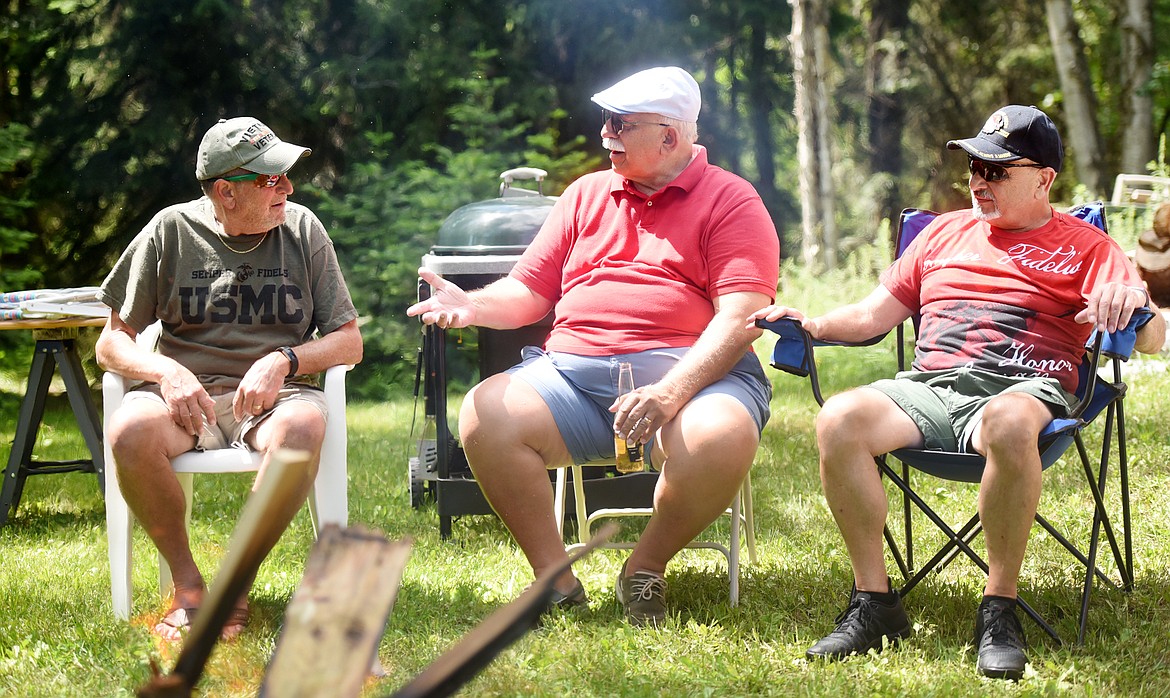 From left, John Frisby, John DeNardo and Joe Silva tell stories in between picking on each other at the reunion at Michael Jaworsky&#146;s place in Columbia Falls. As the three bicker, their fellow Marines look on and smile noting how &#147;somethings never change.&#148;(Brenda Ahearn/Daily Inter Lake)