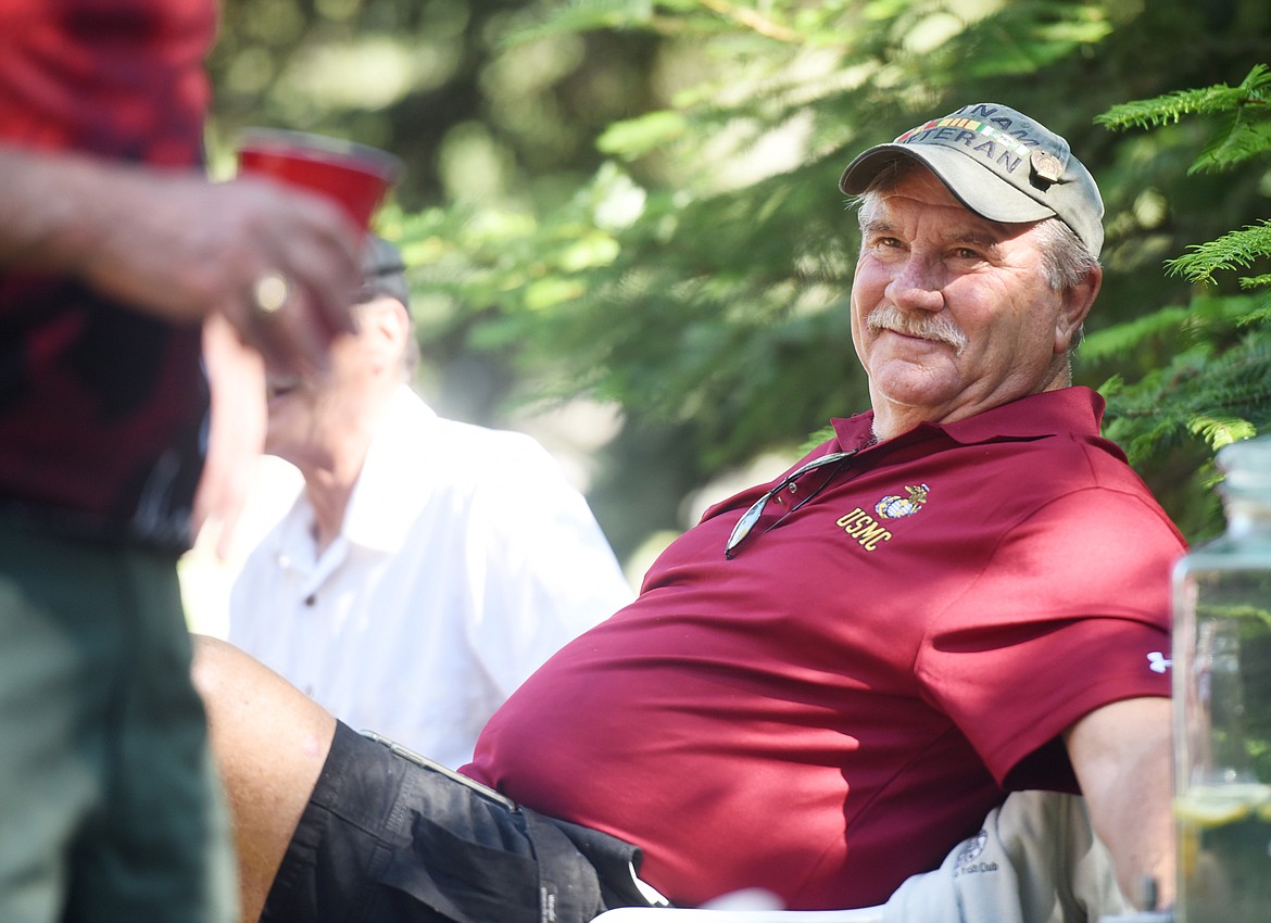 Larry Bruining &#147;Bruno&#148; smiles up at one of his fellow Marines at the Marine Corps reunion on Sunday, June 24, in Columbia Falls.(Brenda Ahearn/Daily Inter Lake)