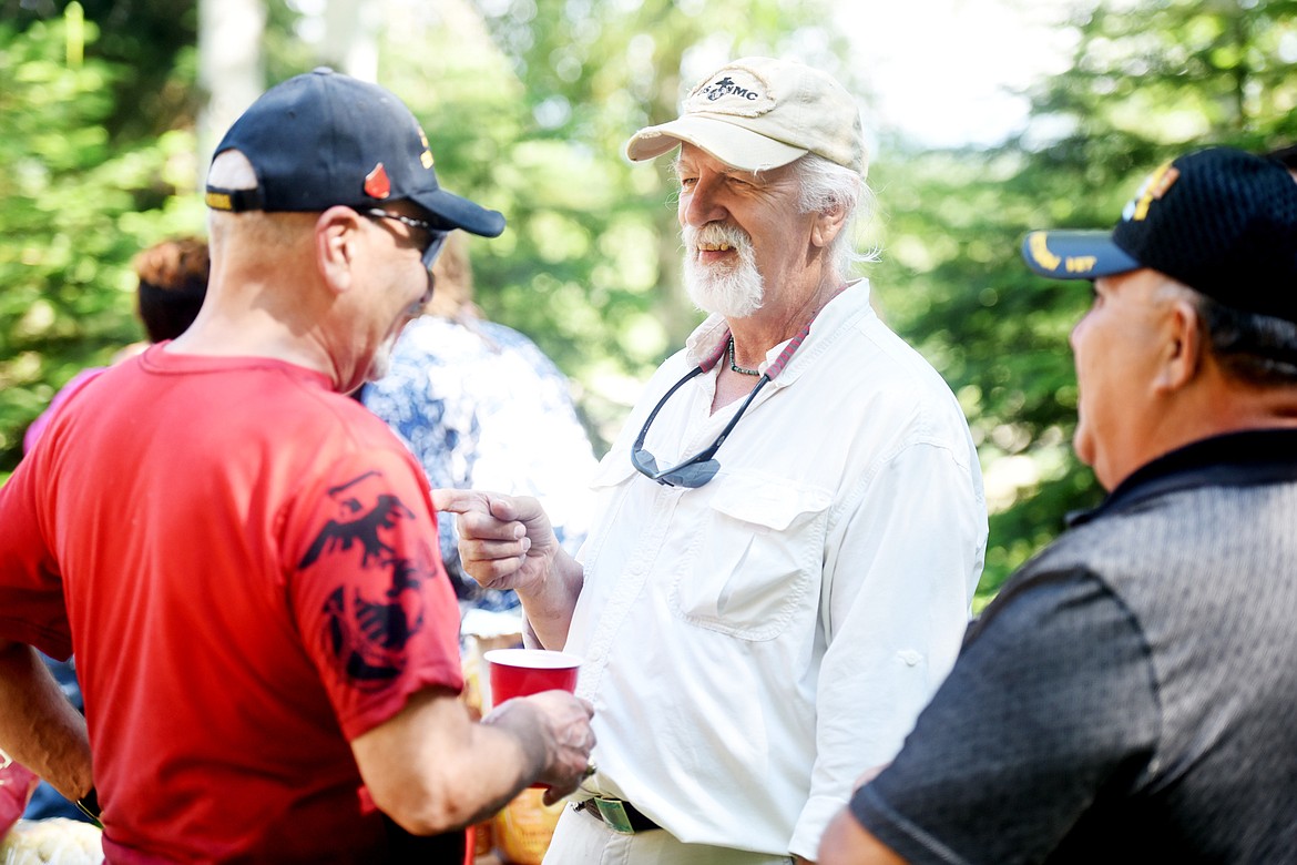 Michael Jaworsky, center, laughs with old friends at the informal reunion he organized at his house in Columbia Falls on Sunday, June 24. For years, Jawworsky &#147;Ski&#148; has been searching for the men he served with.(Brenda Ahearn/Daily Inter Lake)