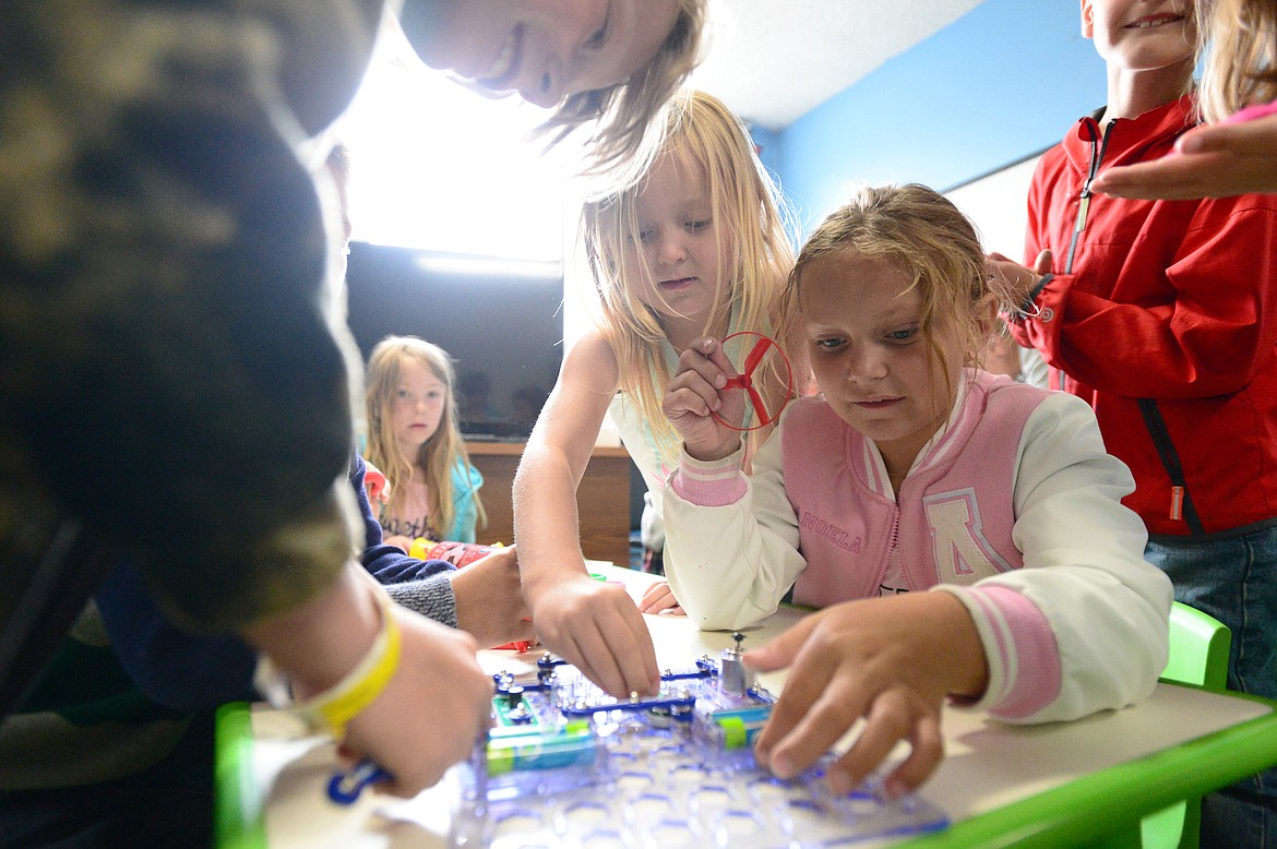 Children in the Red Barons age group (first and second grade) work on an electronic snap circuits project at a Bigfork ACES summer camp on Friday, June 29. Earlier this month, ACES learned it was not selected to receive 21st-Century Community Learning Center grant funding, which impacts before- and after-school programming not only in Bigfork, but also in Deer Park, Kila and Marion schools. (Casey Kreider/Daily Inter Lake)