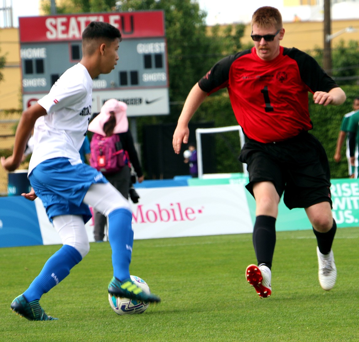 Pam Schmidt photoJosh Lembcke of Team Washington Huskies competes for a ball at the midfield during the Othello team's game against Kansas at the Special Olympic USA Games in Seattle. Team Washington Huskies won the gold medal in the Division 1 (five-on-five).