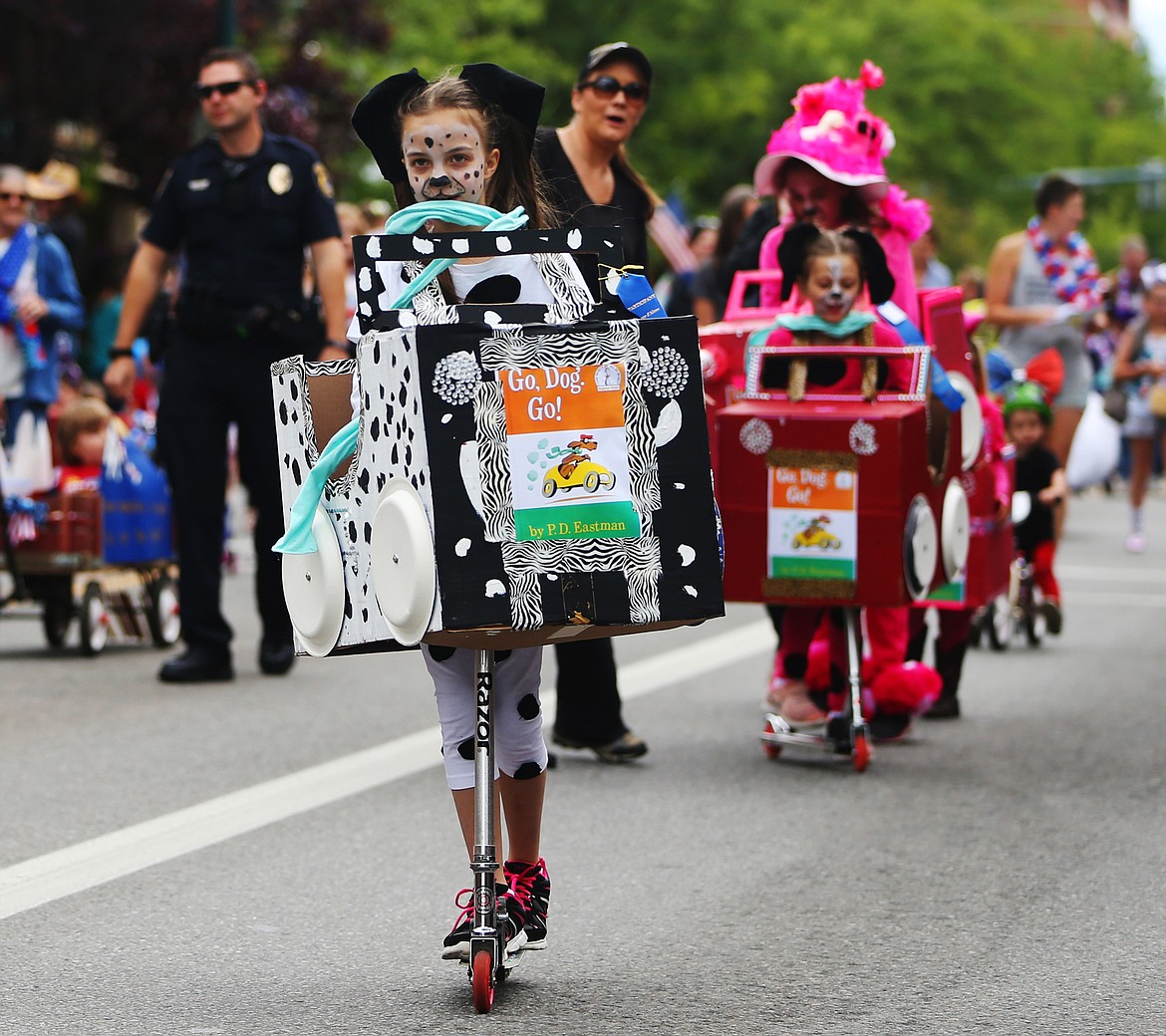 LOREN BENOIT/Press
Jolie Hunt rides her scooter down Sherman Avenue during Coeur d&#146;Alene&#146;s Kids Parade on Tuesday.