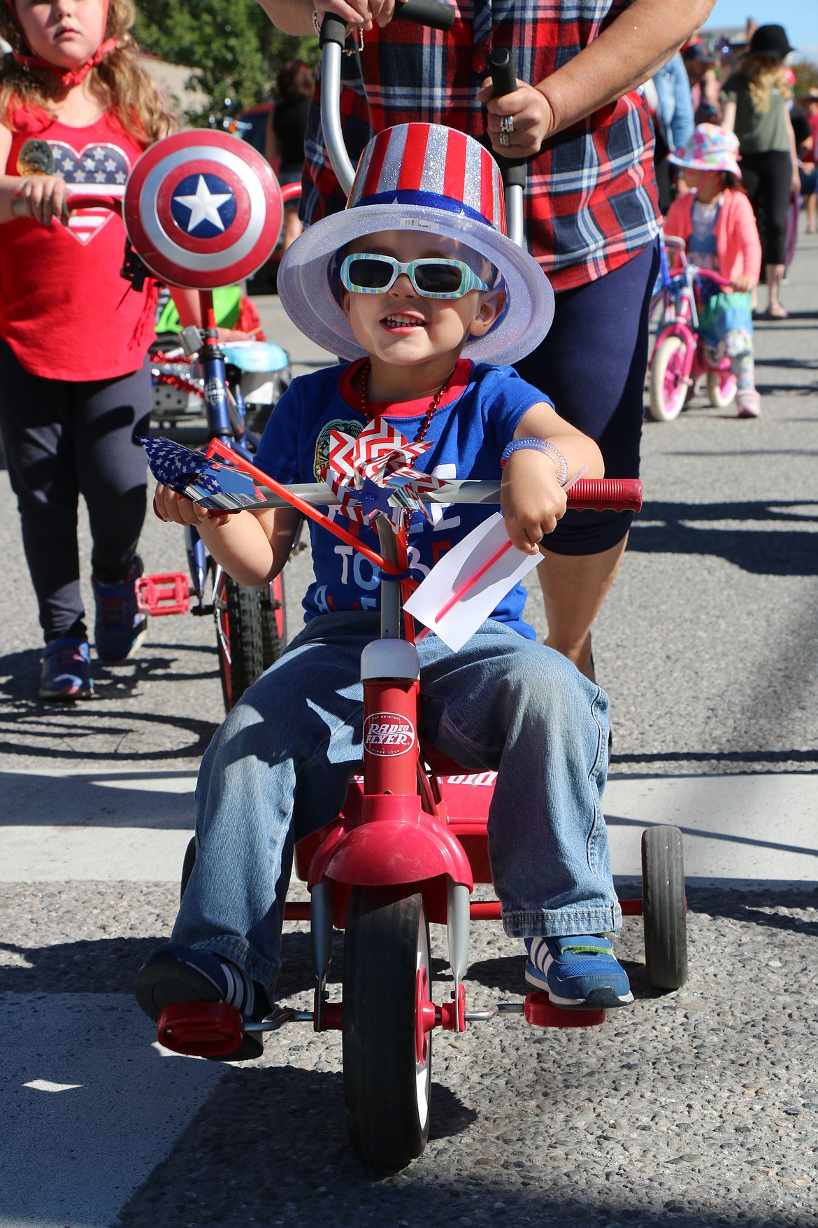 (Photo by CAROLINE LOBSINGER)A youngster waits for the start of the Sandpoint Lions' Kids Parade on the Fourth of July Wednesday.